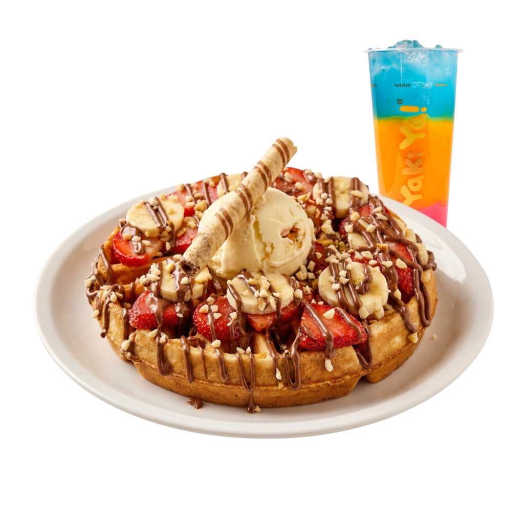 Fresh waffle dessert topped with strawberries, bananas, vanilla ice cream and chocolate sauce at Yaki Ya!